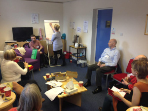 Image of the group hard at work sharing their ideas.